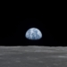 View of Moon limb with Earth on the horizon,Mare Smythii Region. Earth rise. This image was taken before separation of the LM and the Command Module during Apollo 11 Mission. Original film magazine was labeled V. Film Type: S0-368 Color taken with a 250mm lens.  Approximate photo scale 1:1,300,000. Principal Point Latitude was 3 North by Longitude 85 East. Foward overlap is 90%. Sun angle is High. Approximate Tilt minimum is 65 degrees,maximum is 69. Tilt direction is West (W).