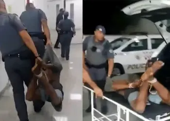 homem amarrado com cordas por policiais